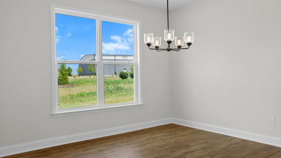 Living area with windows and fireplace.