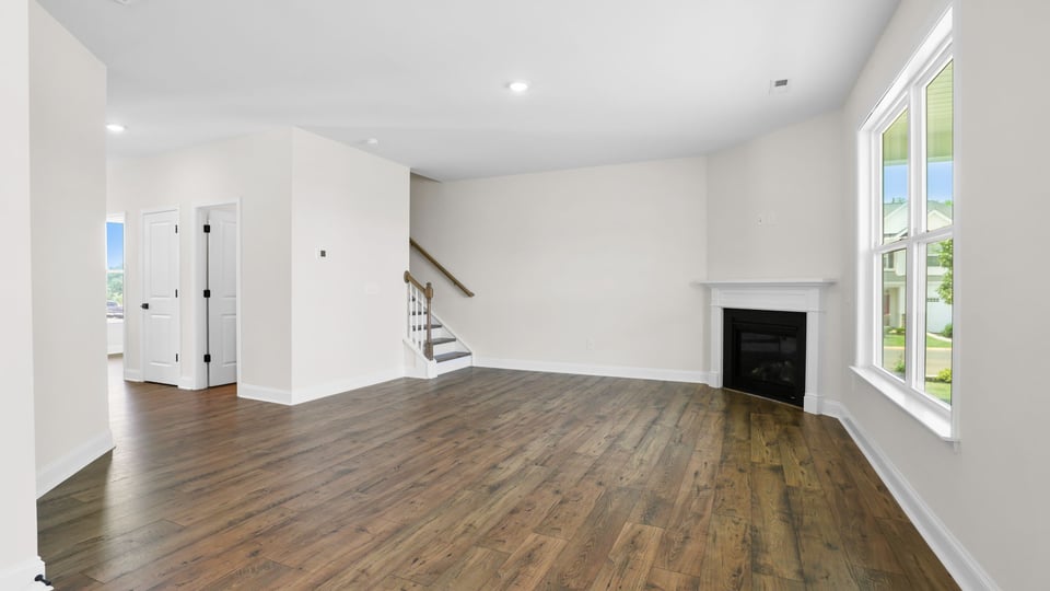 Living area with windows and fireplace.
