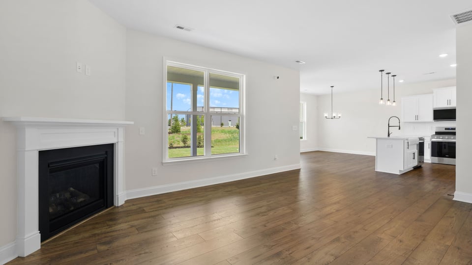 Living area with windows and fireplace.