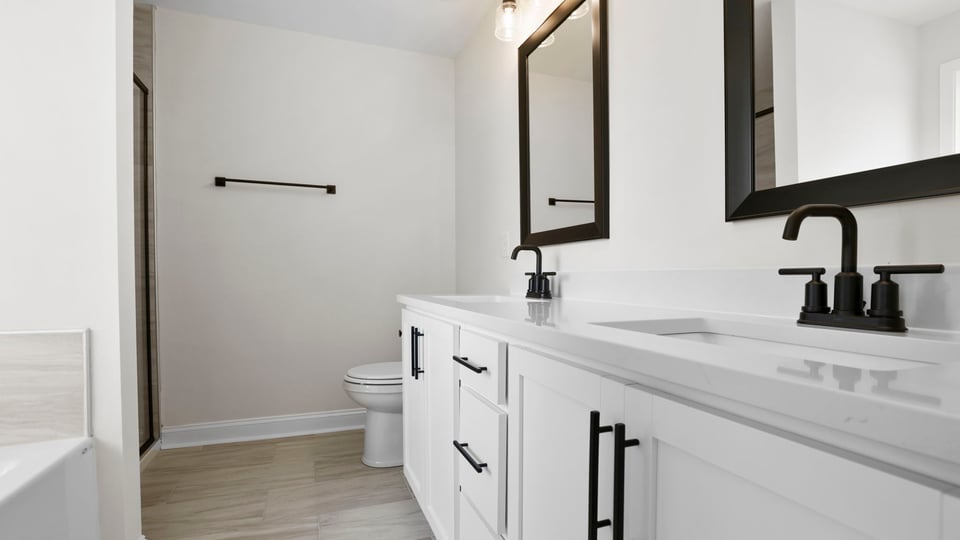 Primary bathroom with double vanity sinks.