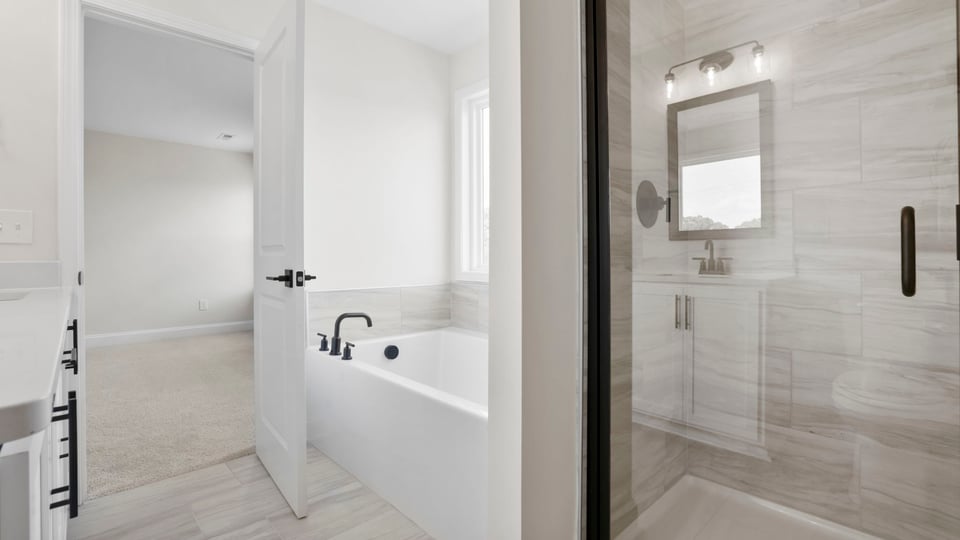 Primary bathroom with double vanity sinks.