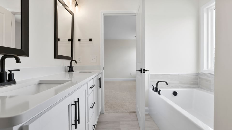 Primary bathroom with double vanity sinks.