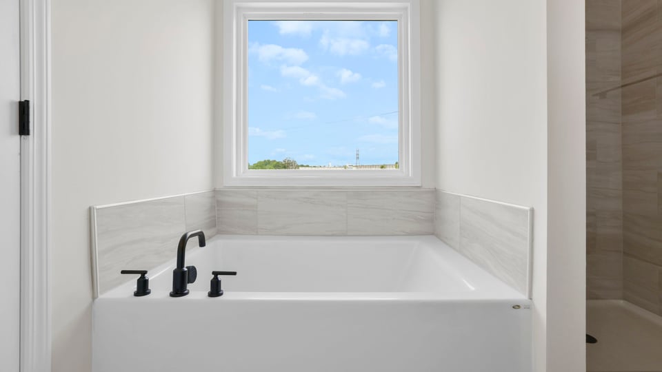 Primary bathroom with double vanity sinks.