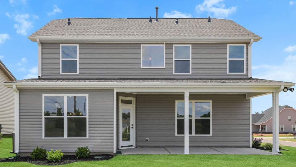 Back exterior with large backyard.