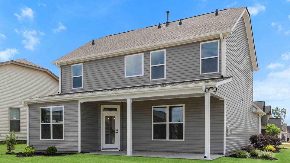 Back exterior with large backyard.