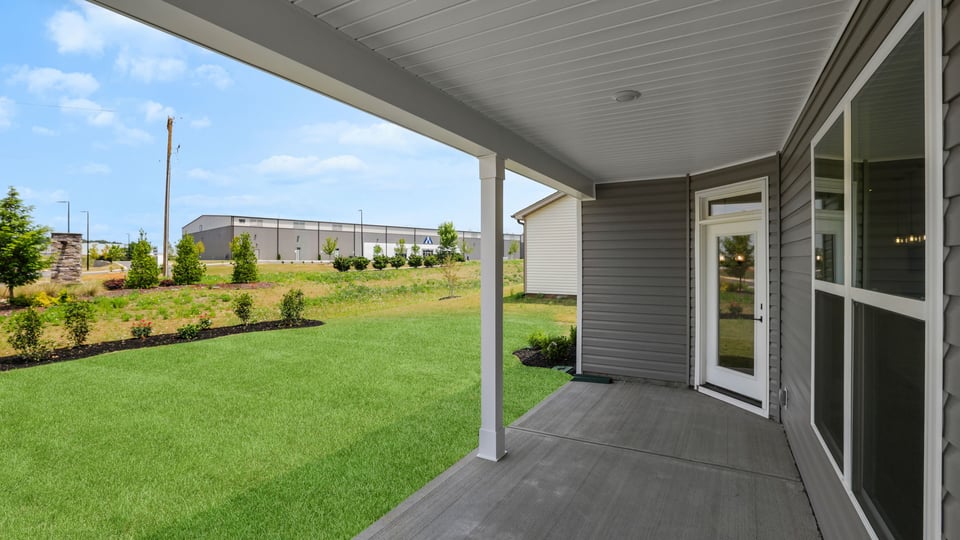 Back exterior with large backyard.
