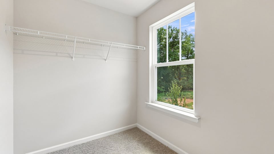 Primary closet with window.