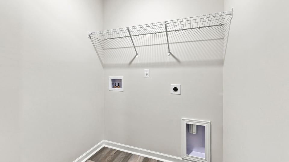 Laundry room with shelf.