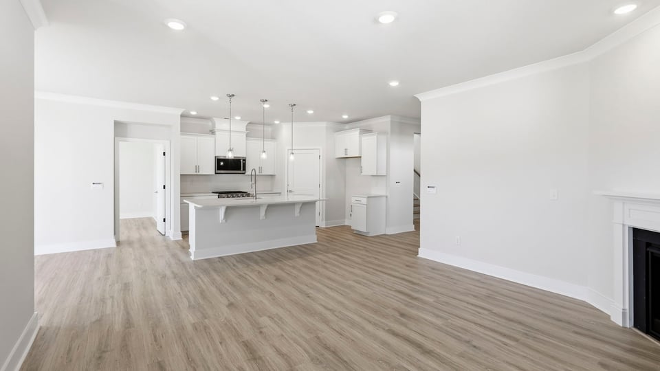 Kitchen and island with quartz countertops.