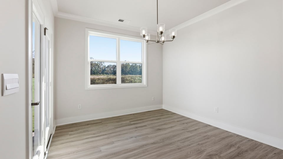 Bedroom with carpet and window.