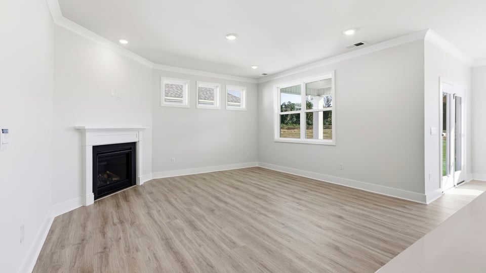 Living room with window and fireplace.
