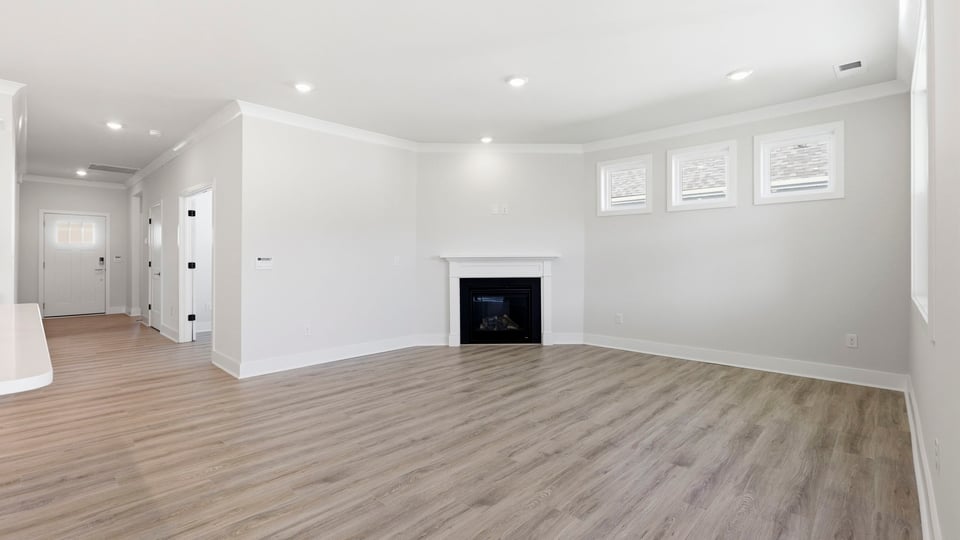 Living room with window and fireplace.
