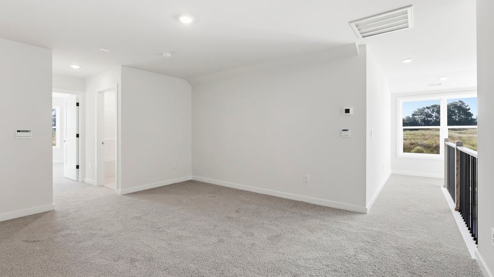 Loft area with carpet.