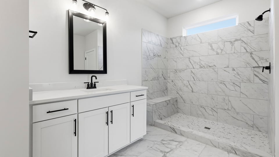 Bathroom with walk in shower.