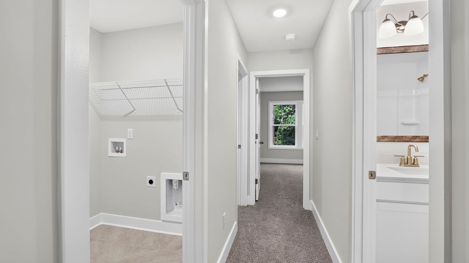 View of hallway with carpet.