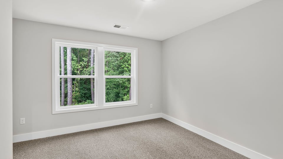 Loft area with carpet.