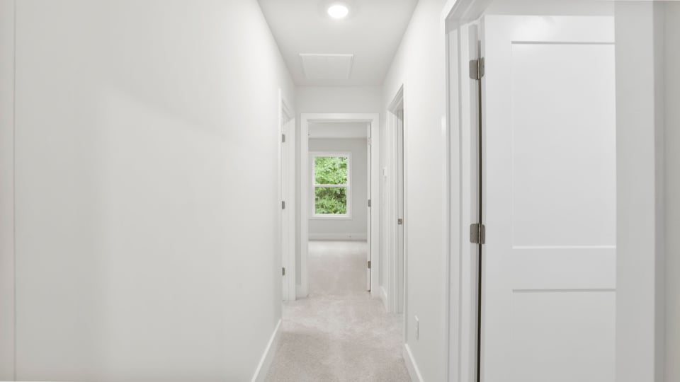 Loft area with carpet.