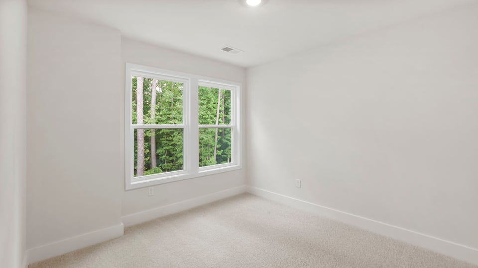 Loft area with carpet.