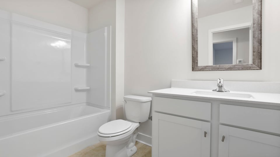 Bathroom with single vanity sink and bathtub.