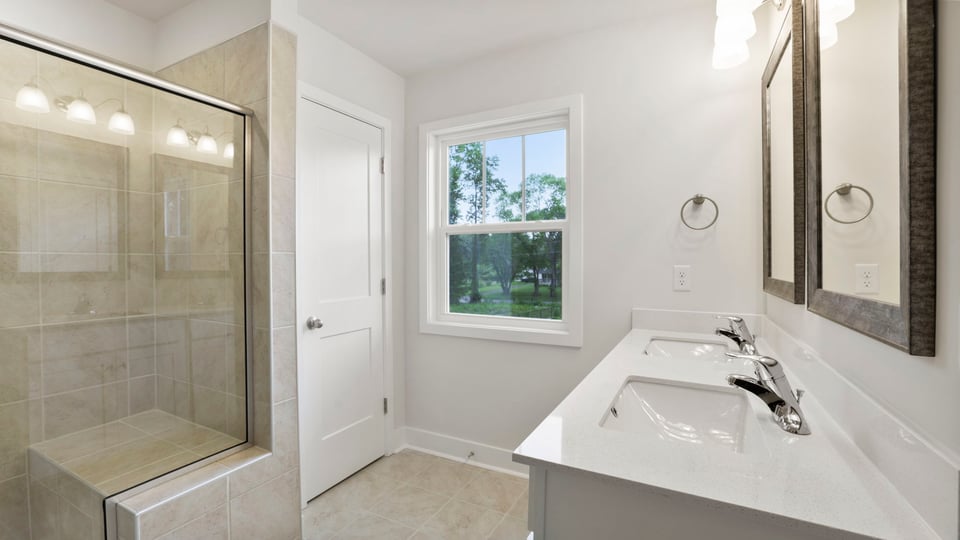 Bathroom with walk in shower.