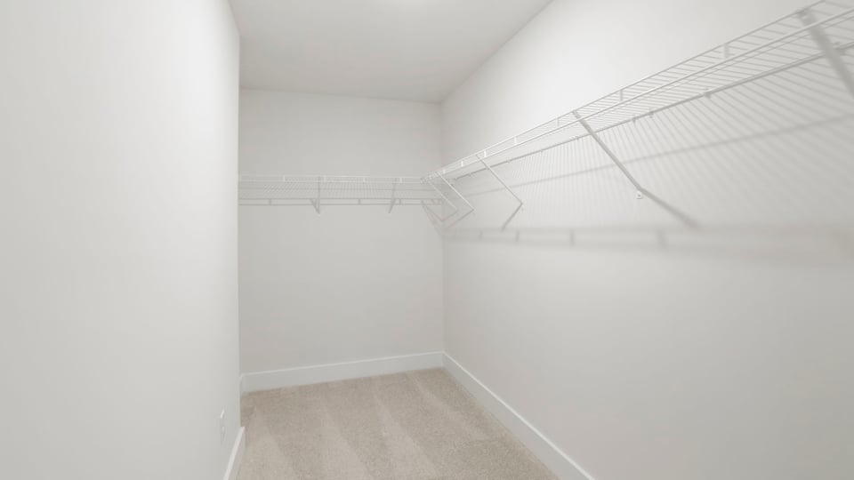 Closet with hanging storage racks.