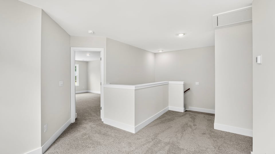 Loft area with carpet.