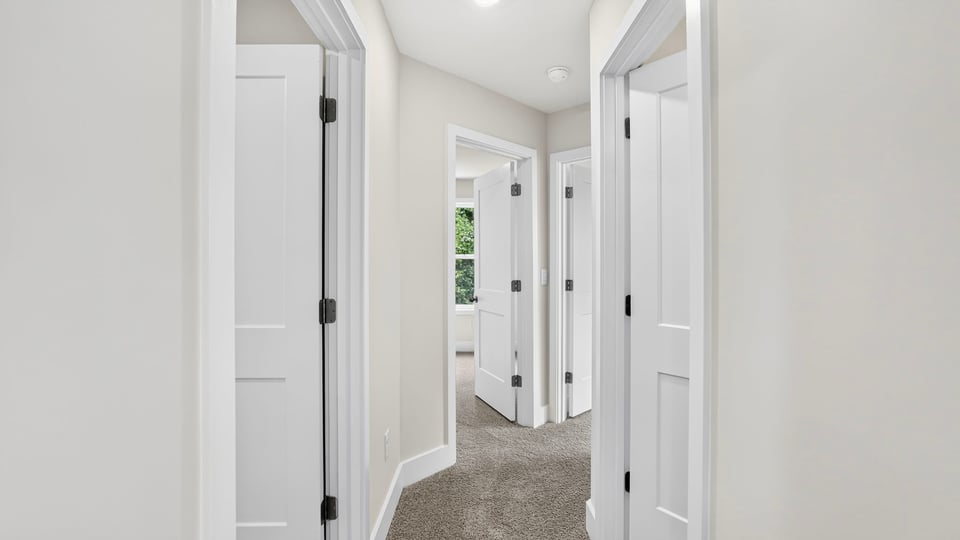 Bedroom with carpet and window.
