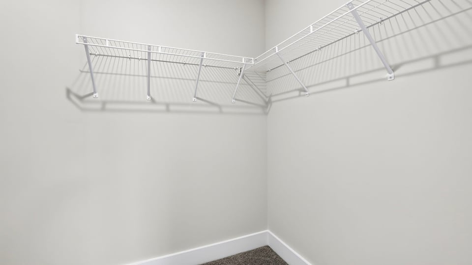Closet with hanging storage racks.
