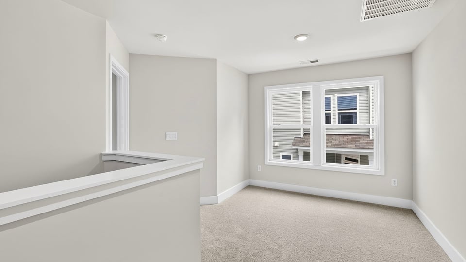 Loft area with carpet.