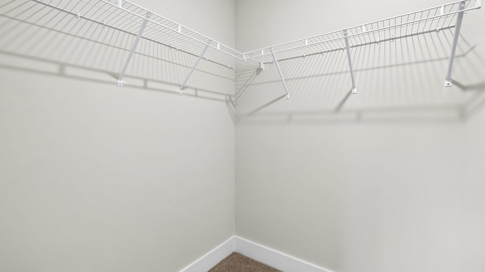 Closet with hanging storage racks.