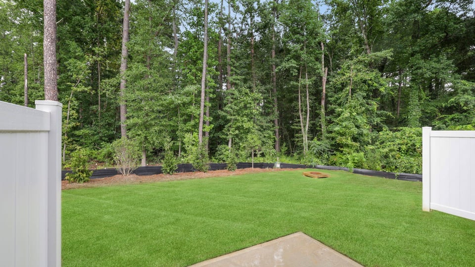 Back exterior of home with patio.