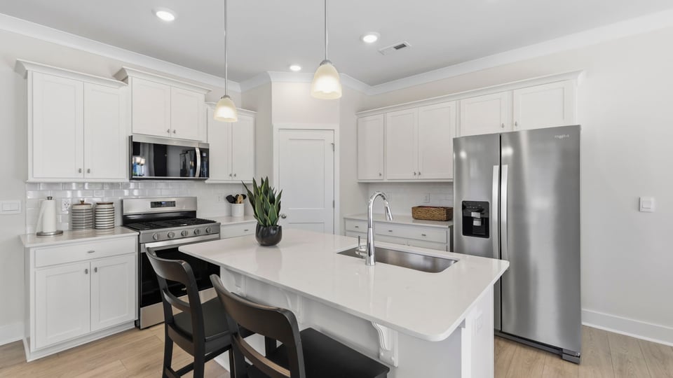Kitchen with large island and countertops.