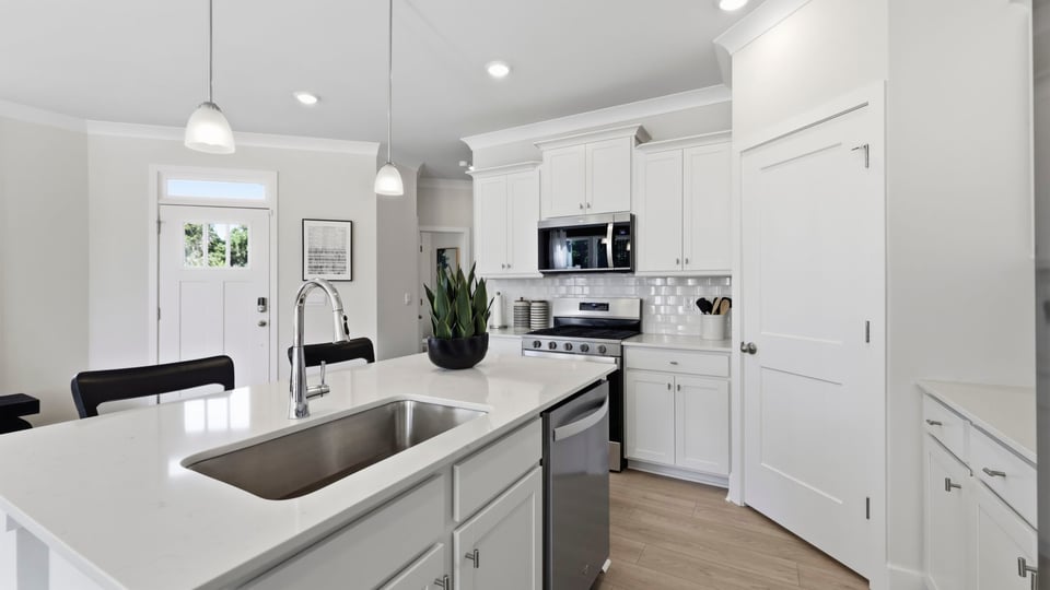 Kitchen with large island and countertops.