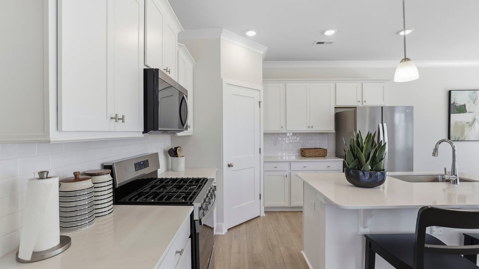 Kitchen with large island and countertops.
