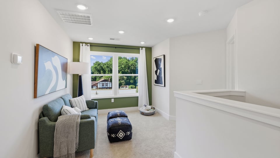 Loft area of home with windows.
