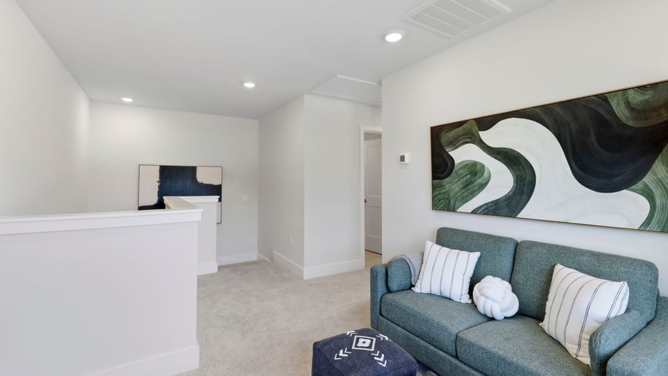 Loft area of home with windows.