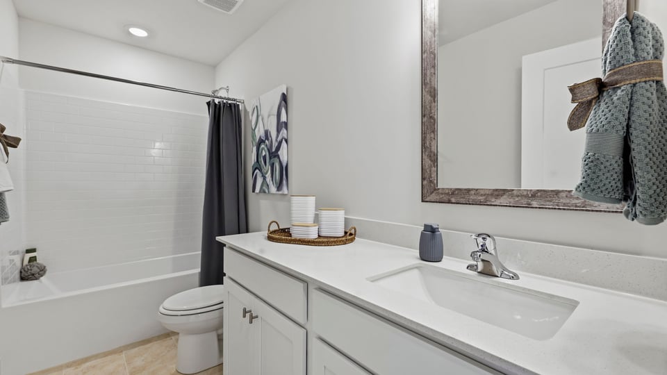 Bathroom with vanity and tub.