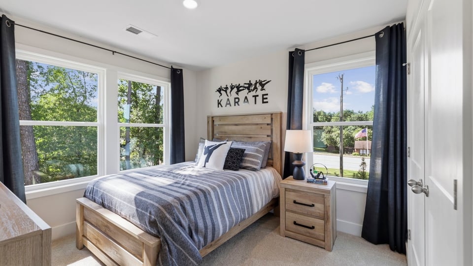 Bedroom with large windows.