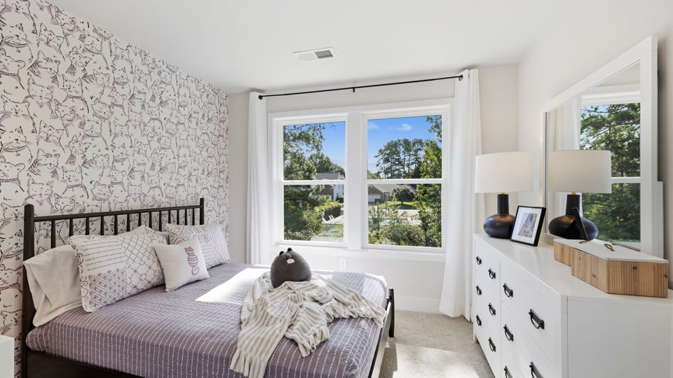 Bedroom with large windows.