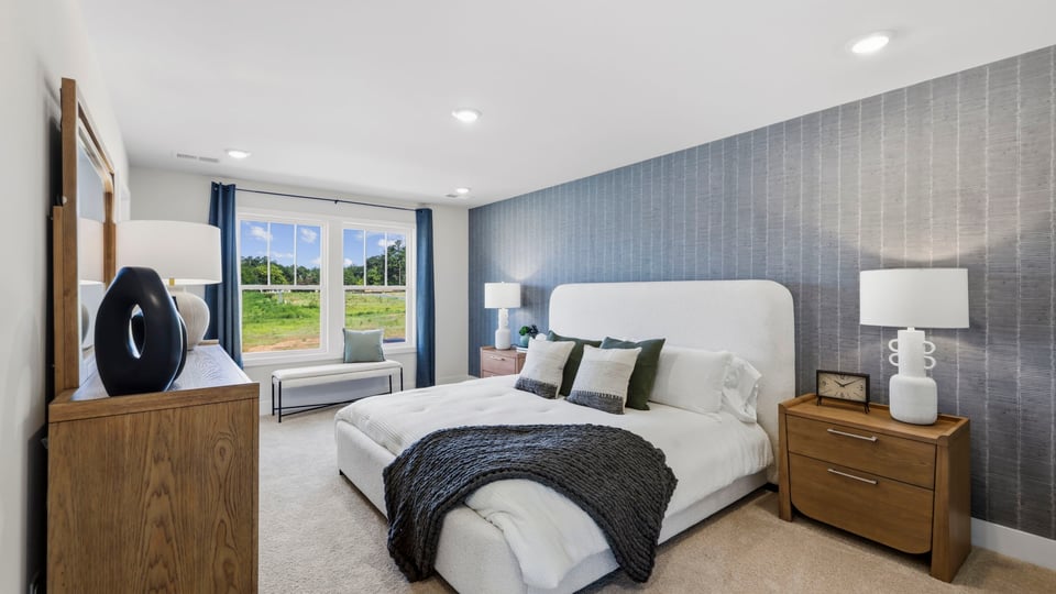 Bedroom with large windows.
