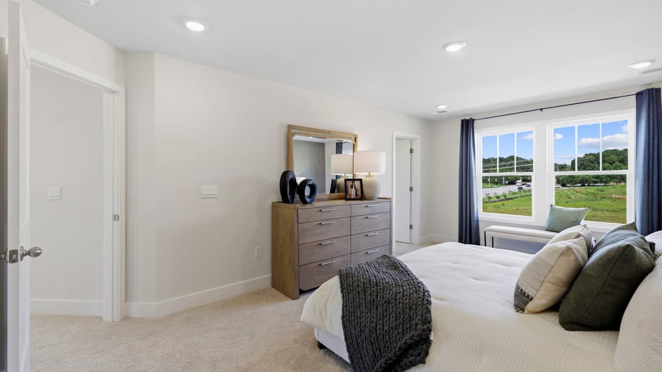 Bedroom with large windows.