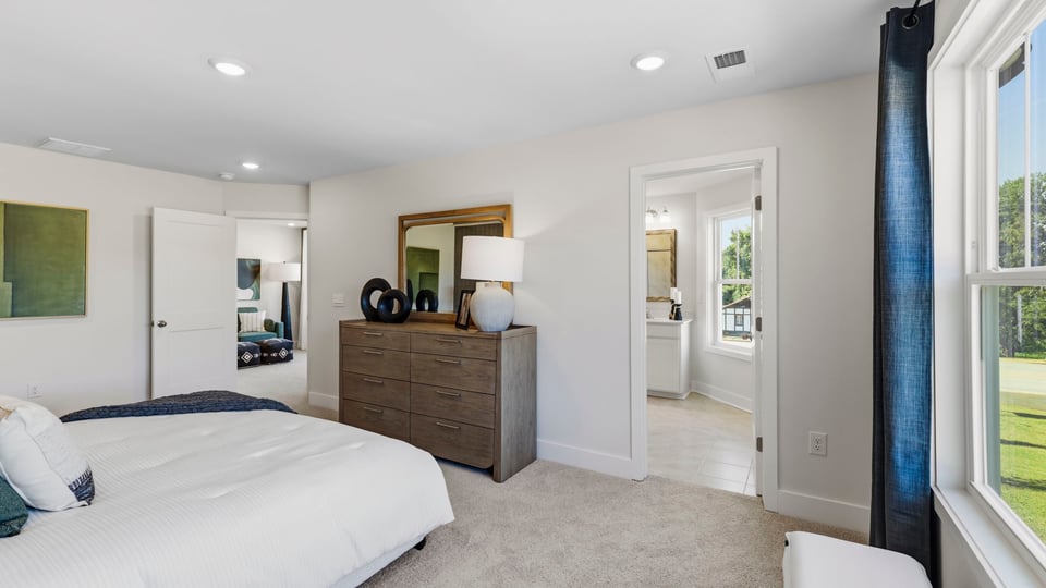 Bedroom with large windows.