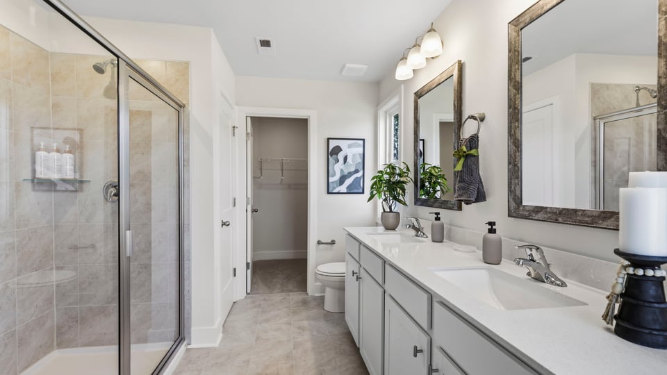 Bathroom with large window and vanity.