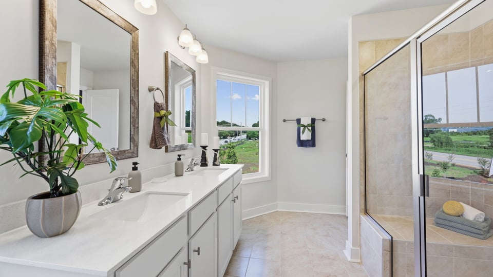 Bathroom with vanity and walk in shower.