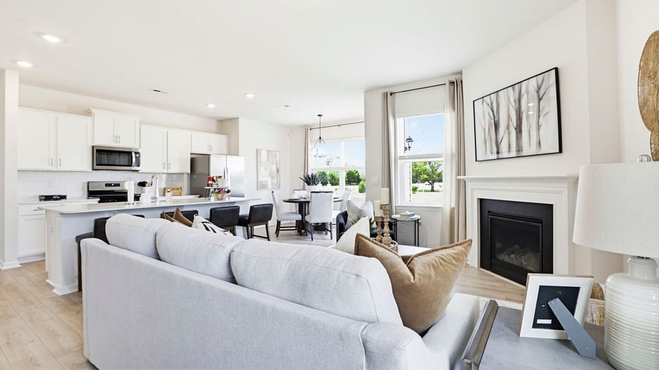 Living area with windows and fireplace.