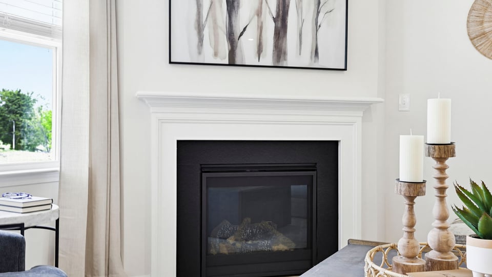 Living area with windows and fireplace.
