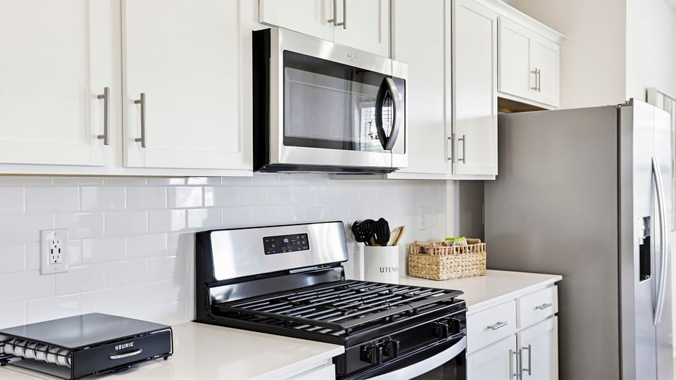 Kitchen with island and cabinets.