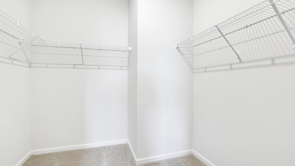 Primary closet with shelf.