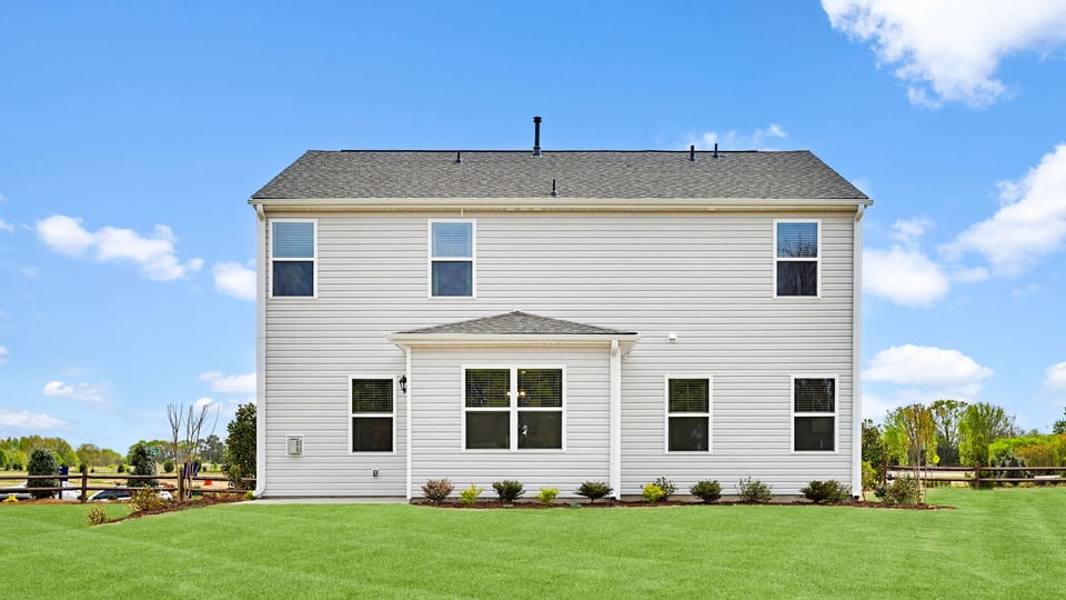 Back exterior with large backyard.