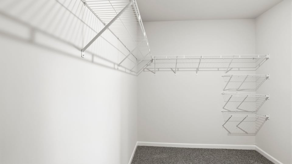 Closet with walk in shower.